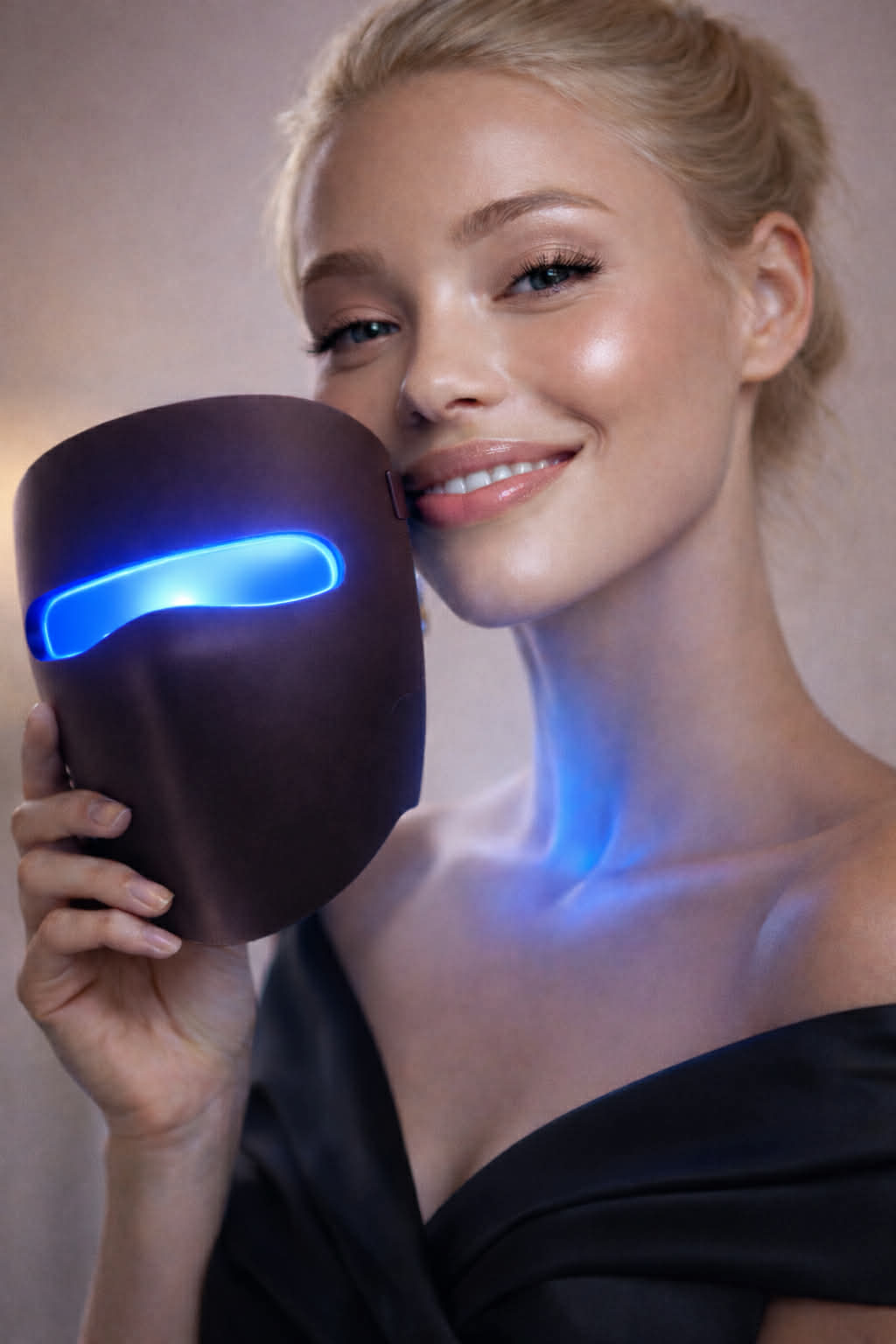 Female model demonstrating LumiAura wireless blue light LED face mask in elegant skincare advertising